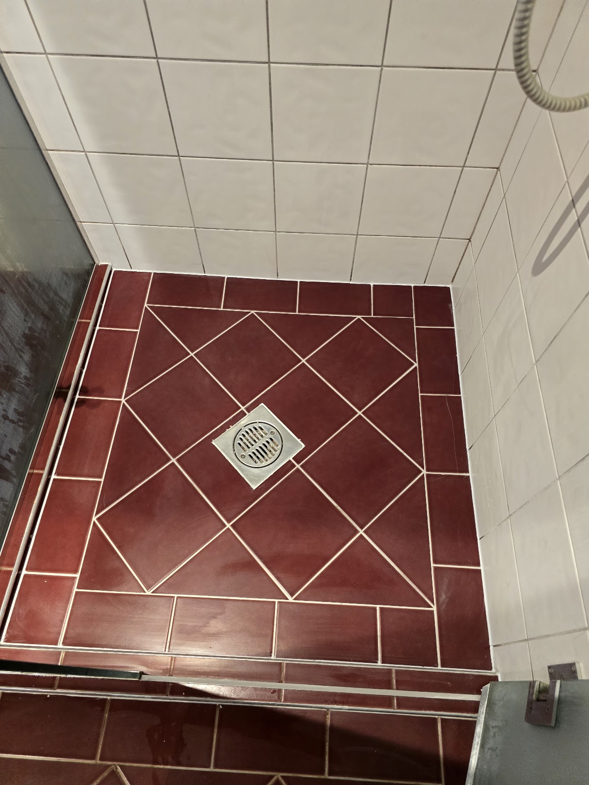 Diamond-pattern red tile shower floor