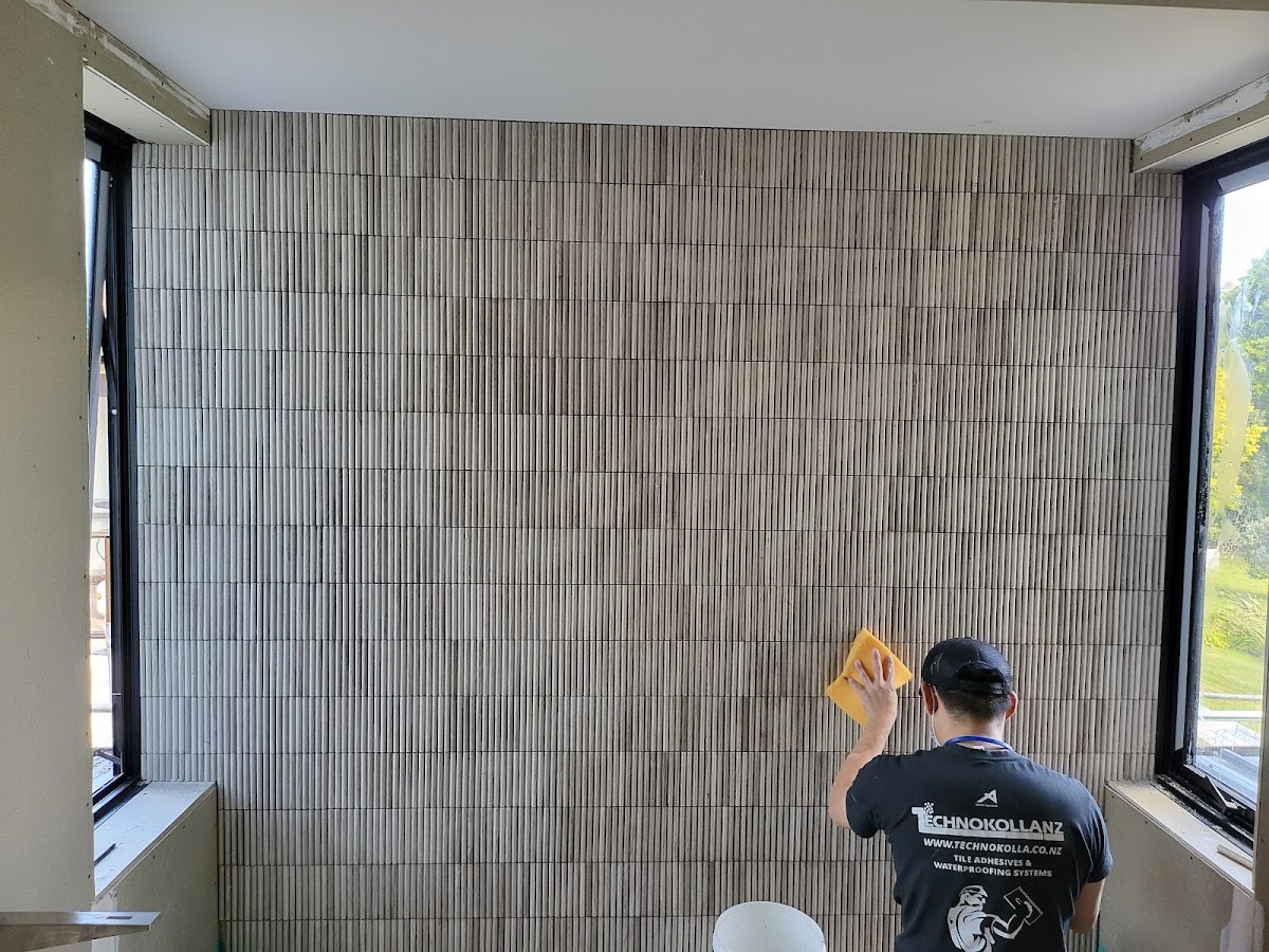 Marco at work on a textured feature wall